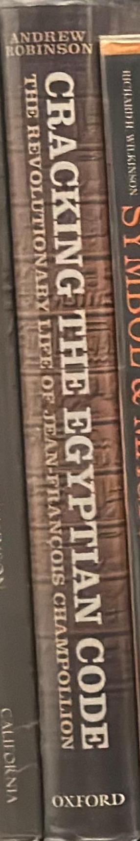 Cracking the Egyptian code : the revolutionary life of Jean-François Champollion / Andrew Robinson spine