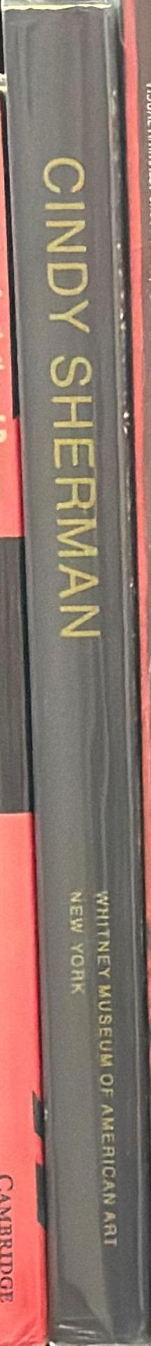 Cindy Sherman / essays by Peter Schjeldahl and Lisa Phillips spine