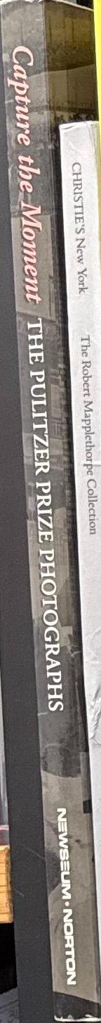 Capture the moment : the Pulitzer Prize photographs / edited by Cyma Rubin and Eric Newton spine